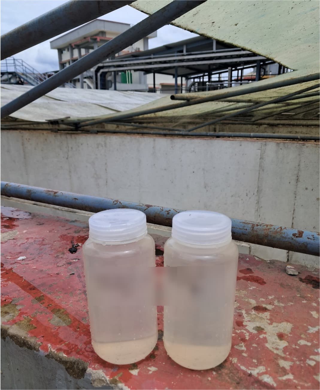 Labeled effluent sample bottles at treatment facility
